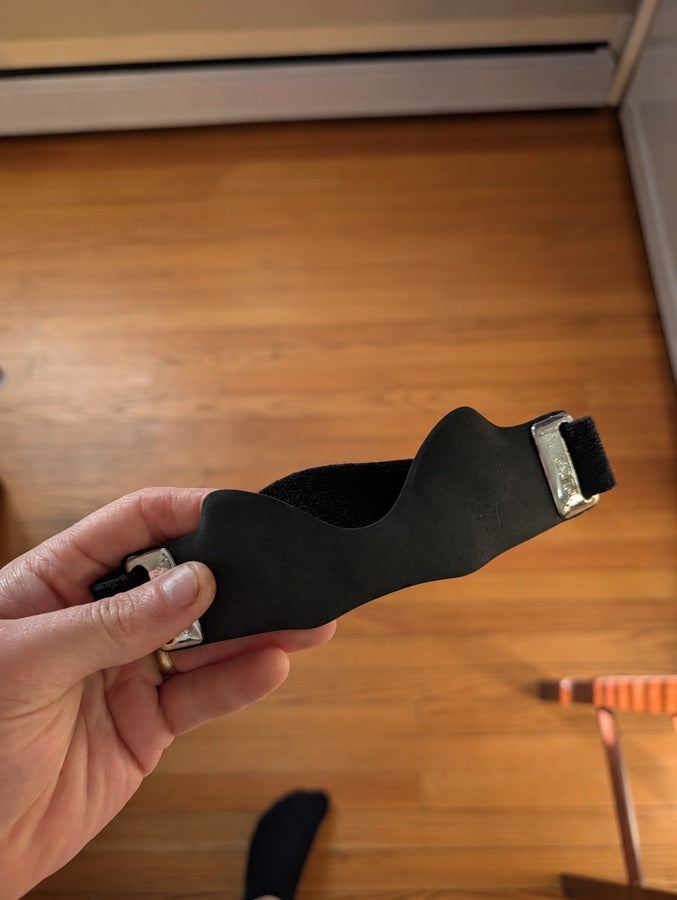 Customer photo of CourtBrace Pro held in hand
